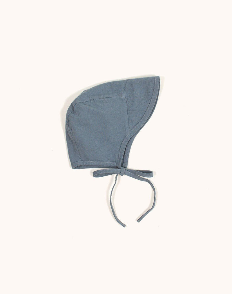 Noble Brimmed Bonnet in Moon Blue tied with a bow